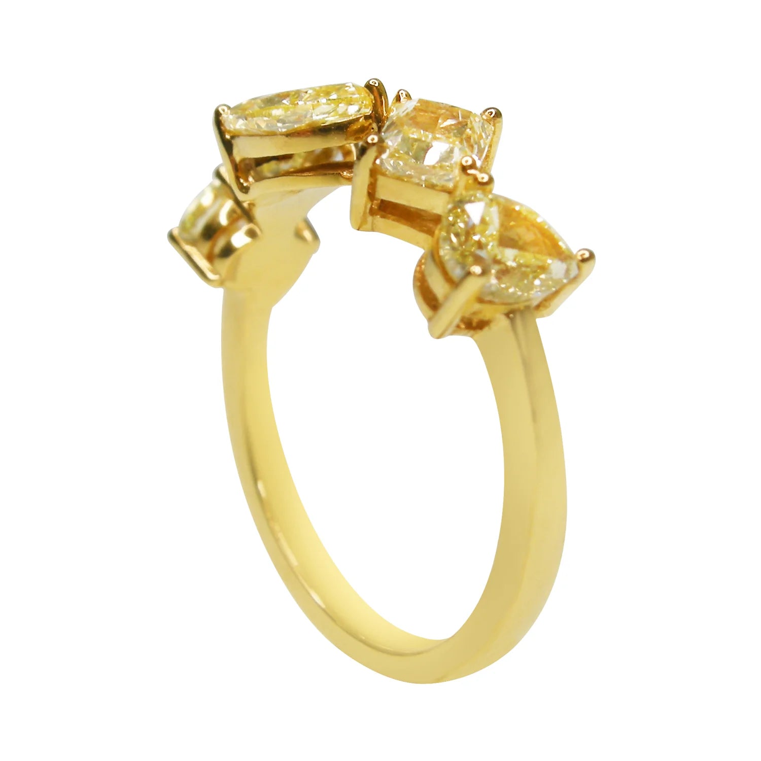 Gold ring with yellow gemstones on a white background