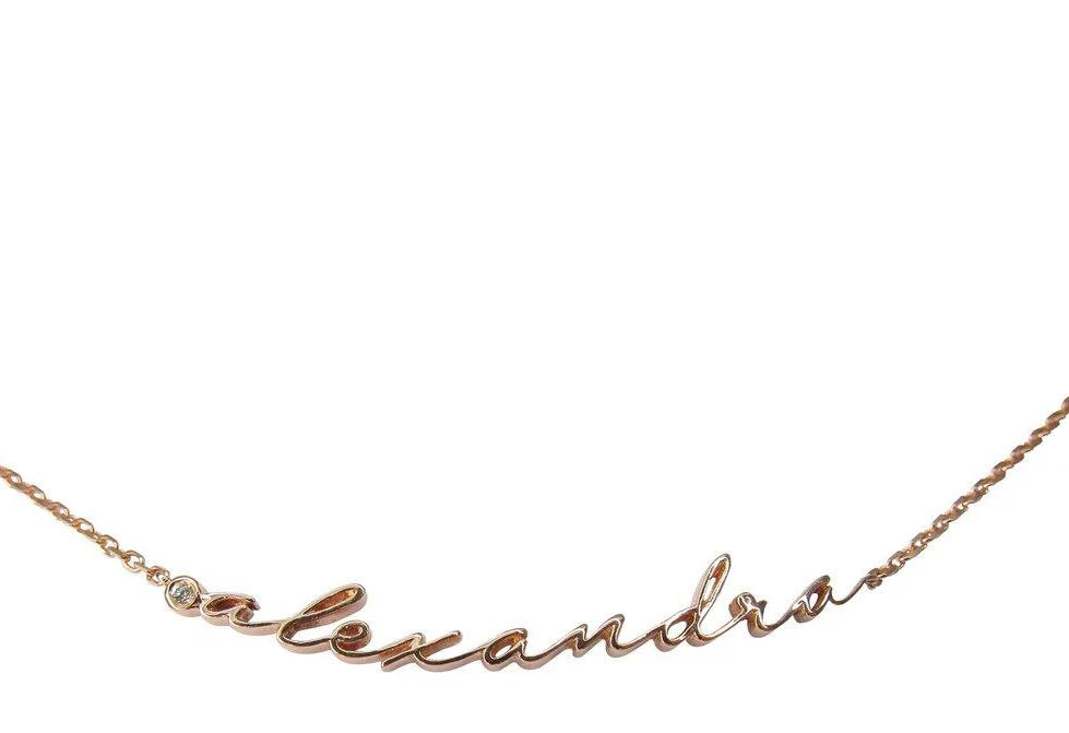 Rose gold necklace with 'alexandra' engraving on a white background