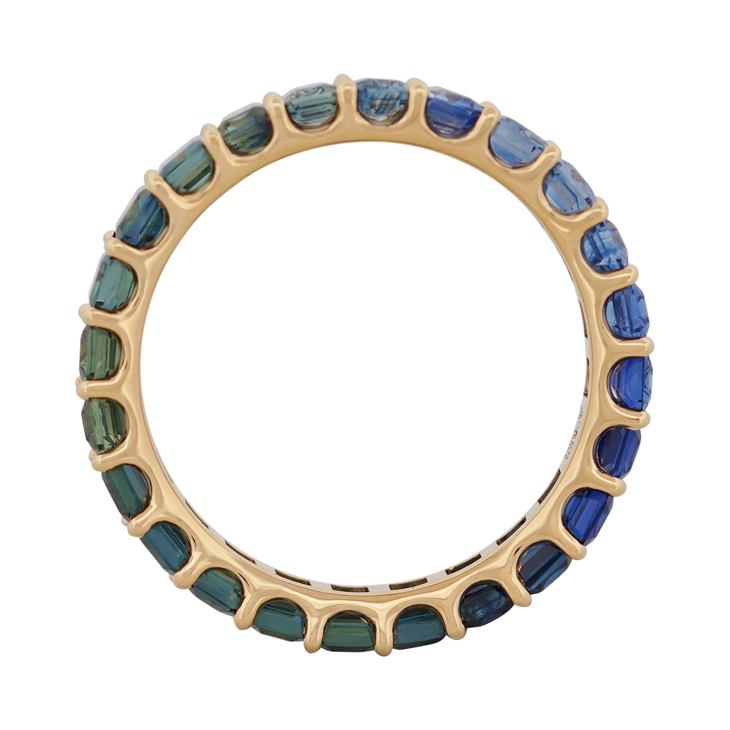 Gold ring with blue and green gemstones on a white background