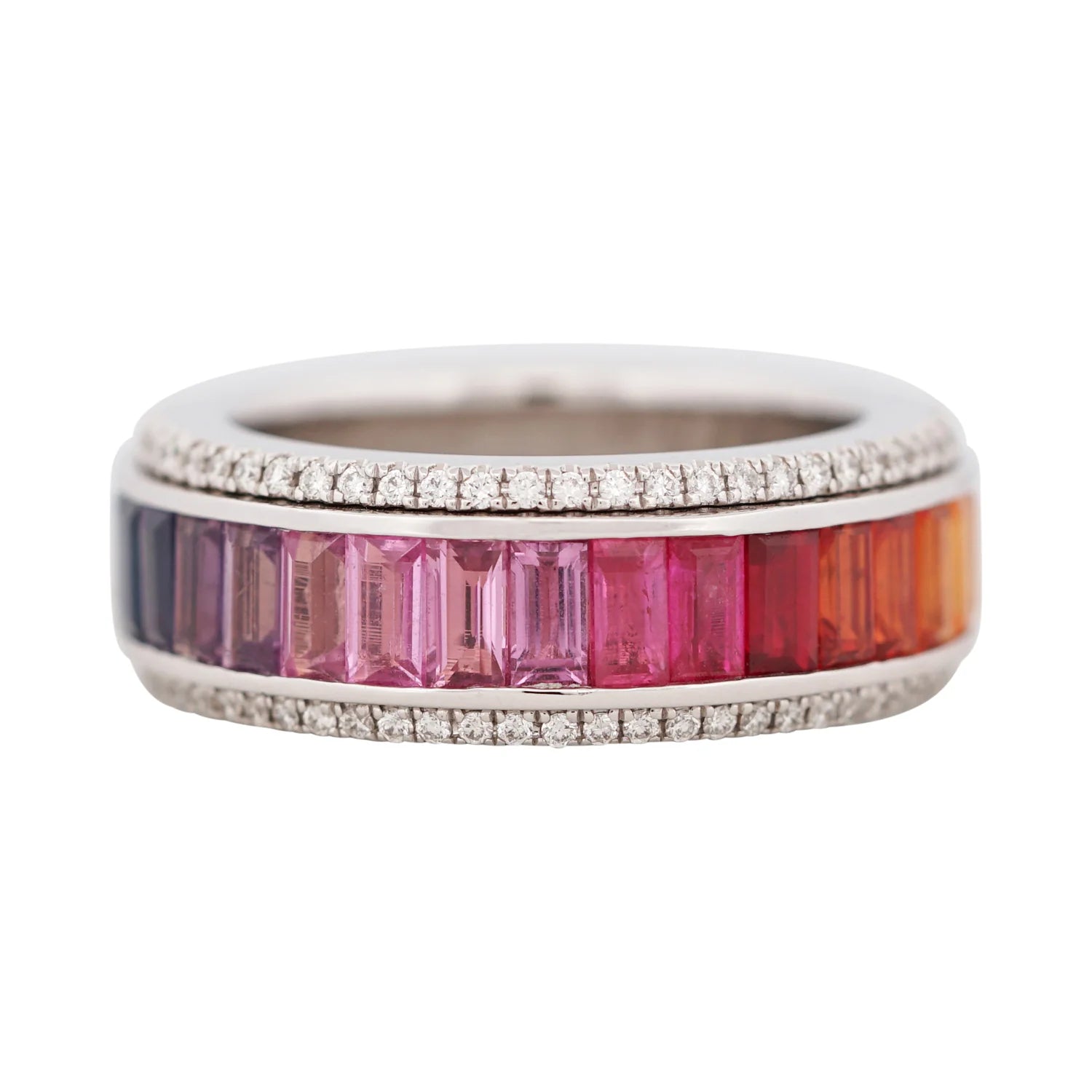 Ring with colorful gemstones and silver band on a white background