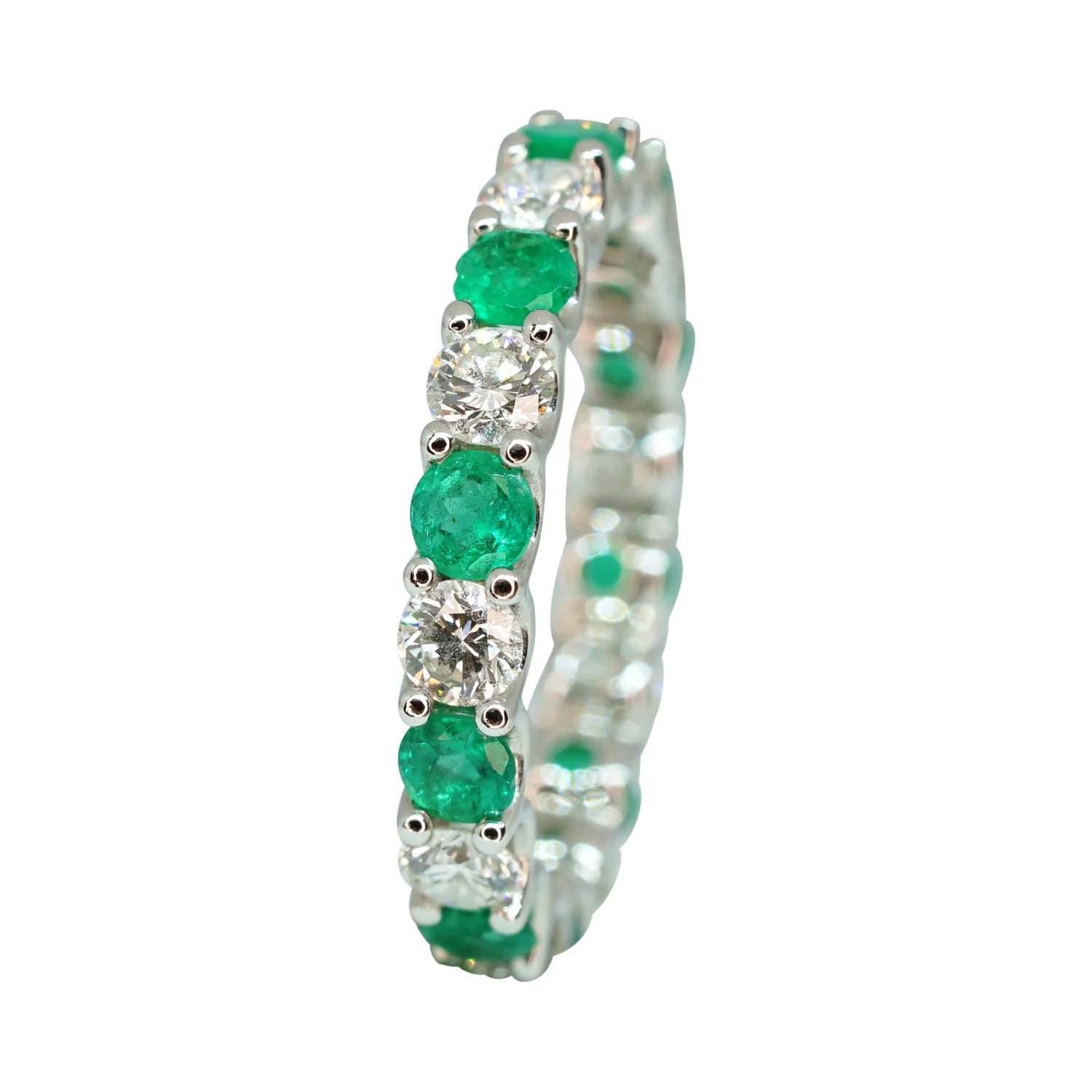 Alternating emerald and diamond eternity band in 18K white gold