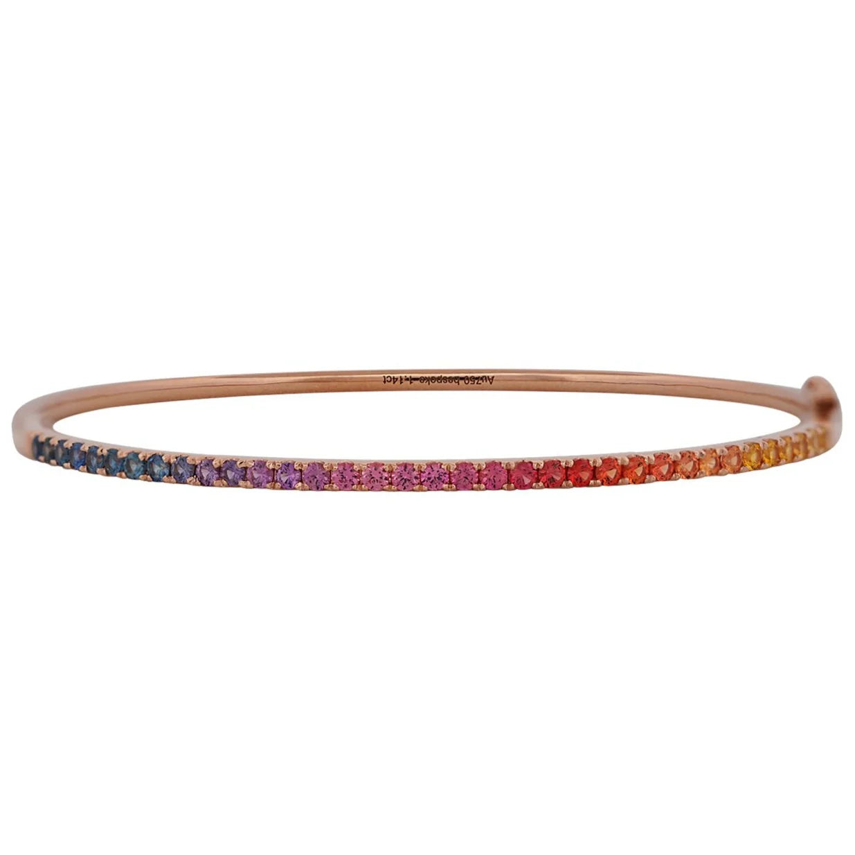 Rose gold bangle with multicolored stones on a white background