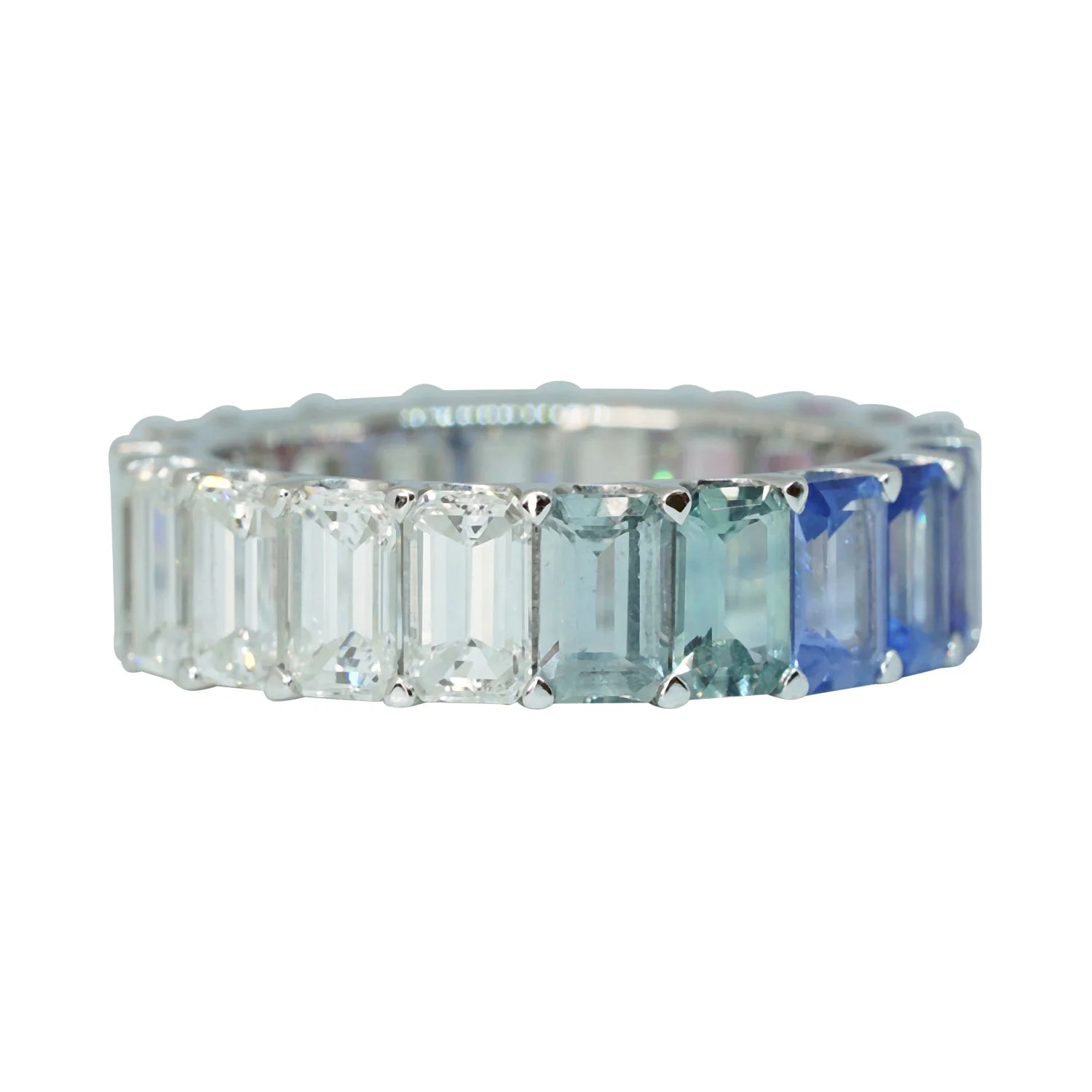 Ring with rectangular gemstones on a white background