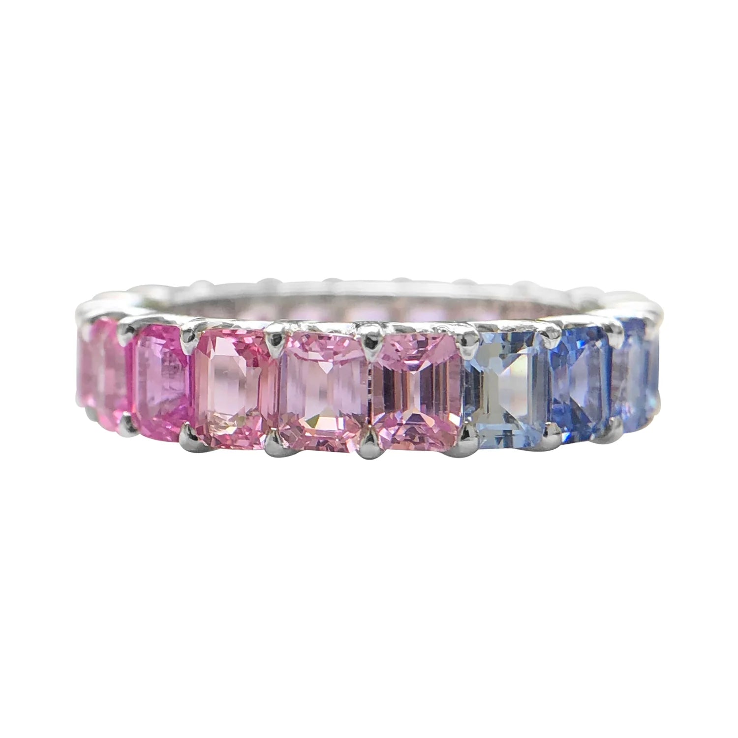 Ring with pink and blue gemstones on a white background