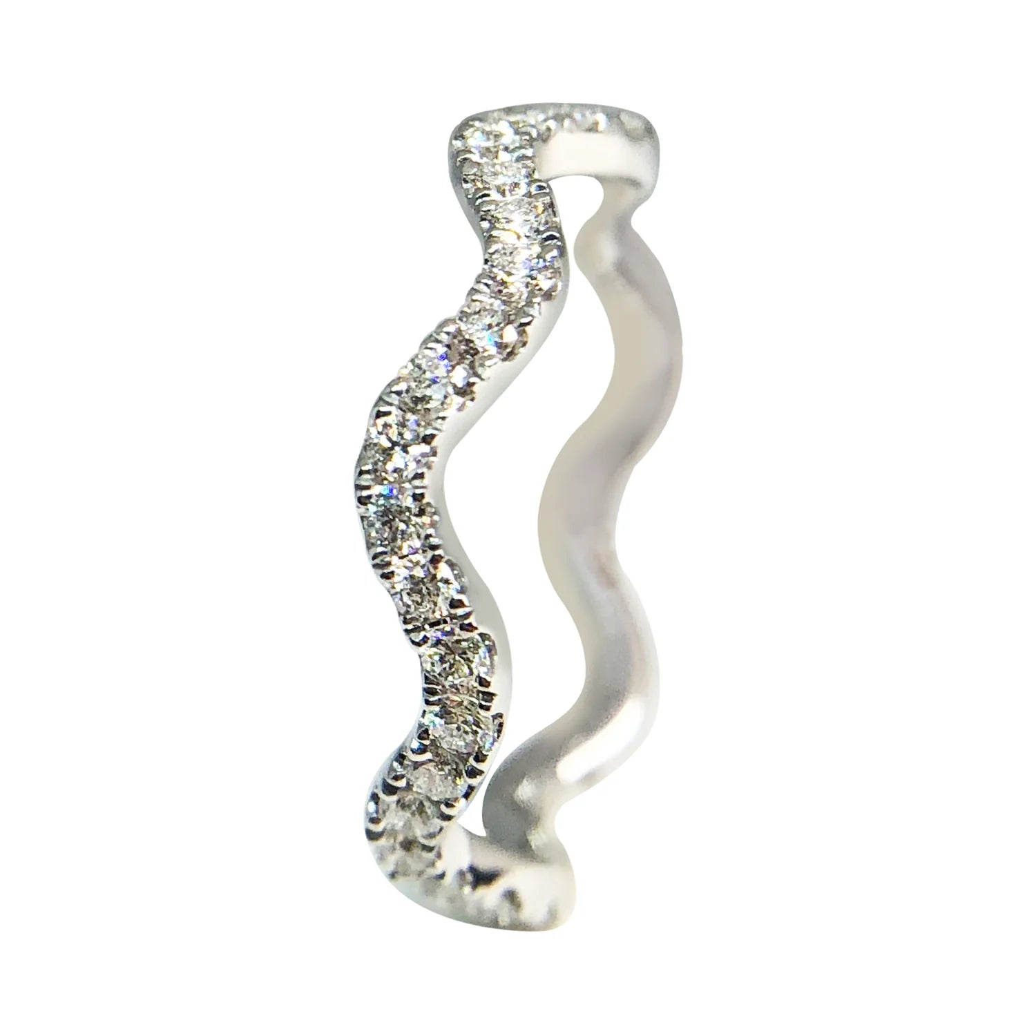 Silver spiral earring with clear gemstones on a white background