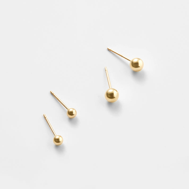 Rose gold 14K ball stud earrings close-up