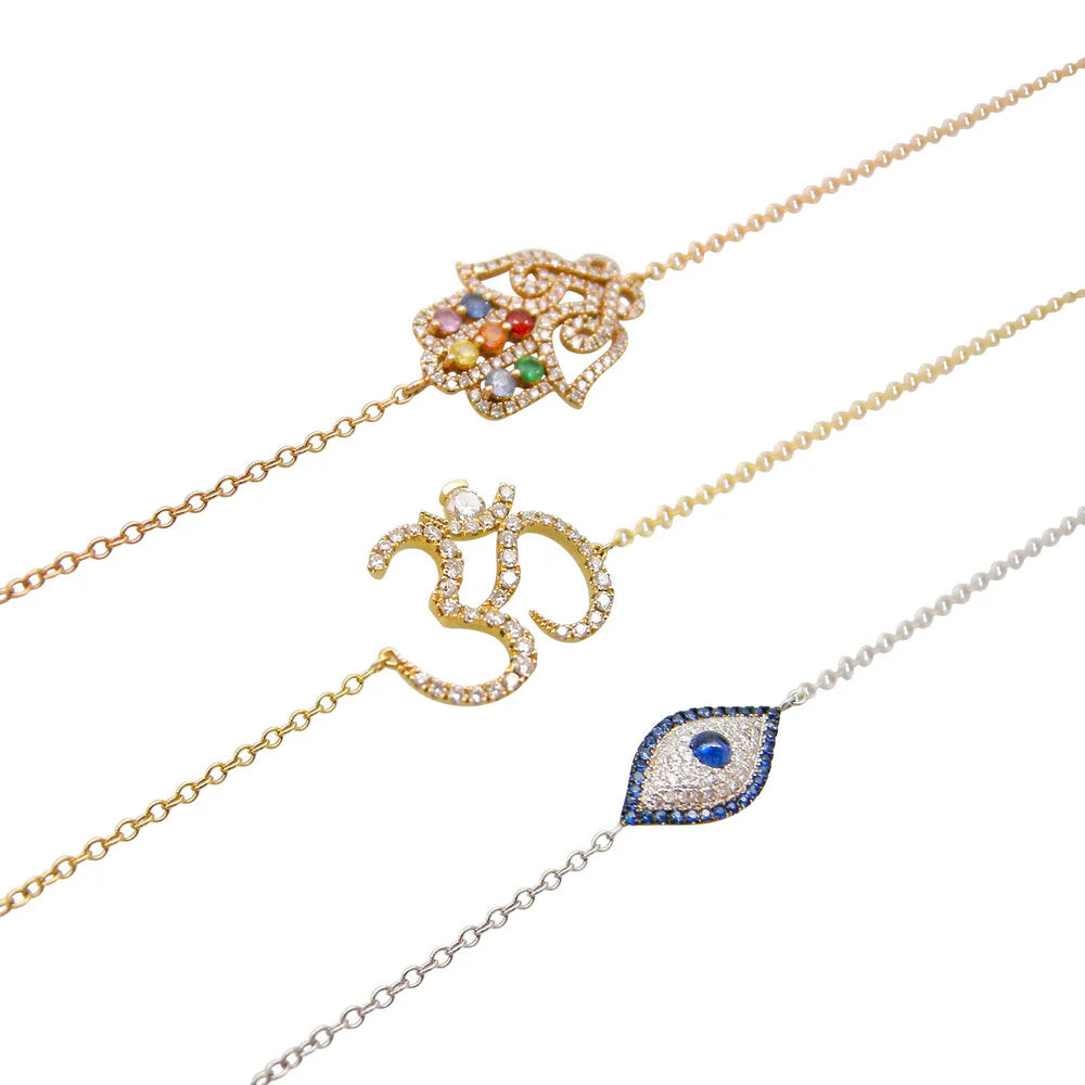 Three gold necklaces with decorative pendants on a white background
