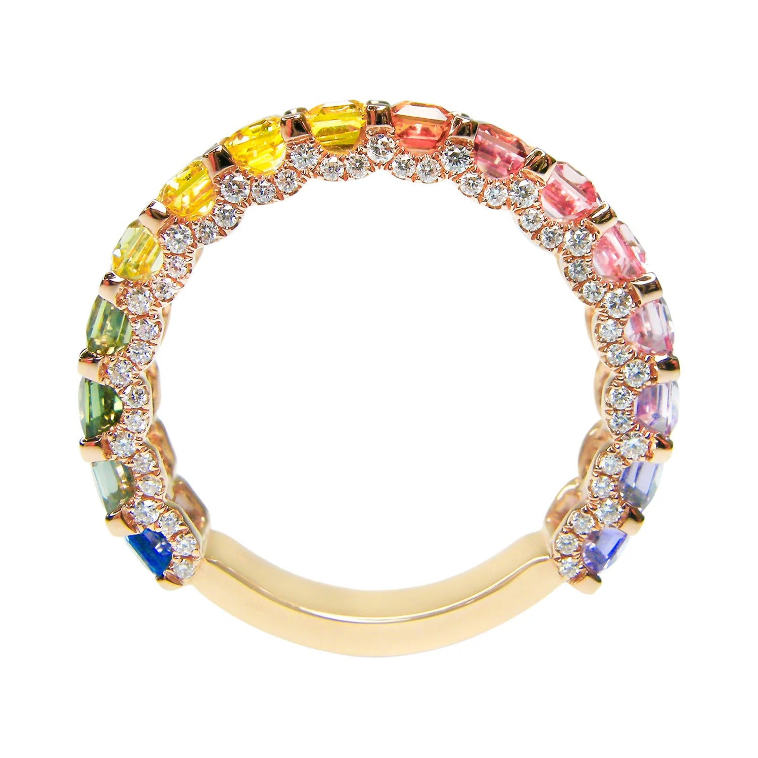 Gold ring with multicolored gemstones on a white background