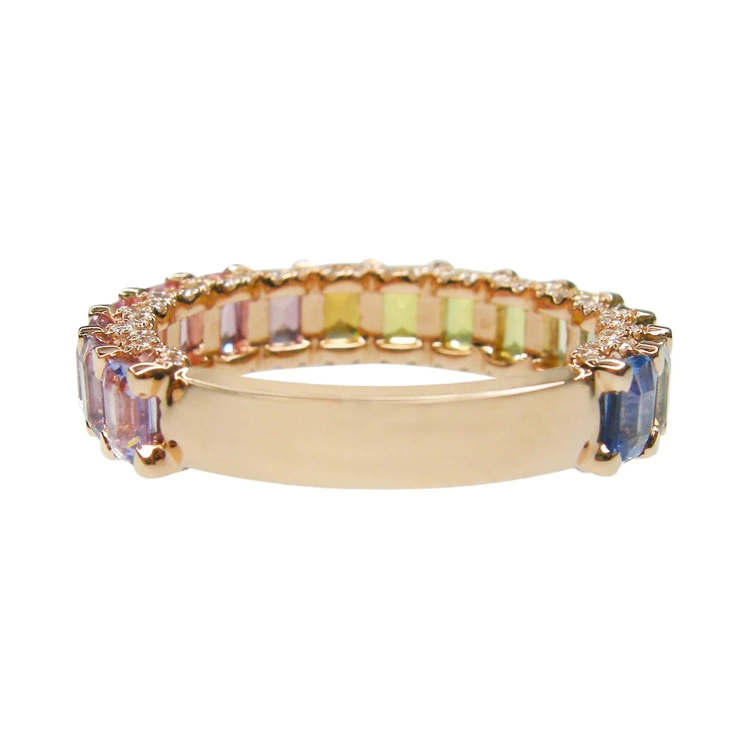 Gold ring with multicolored gemstones on a white background