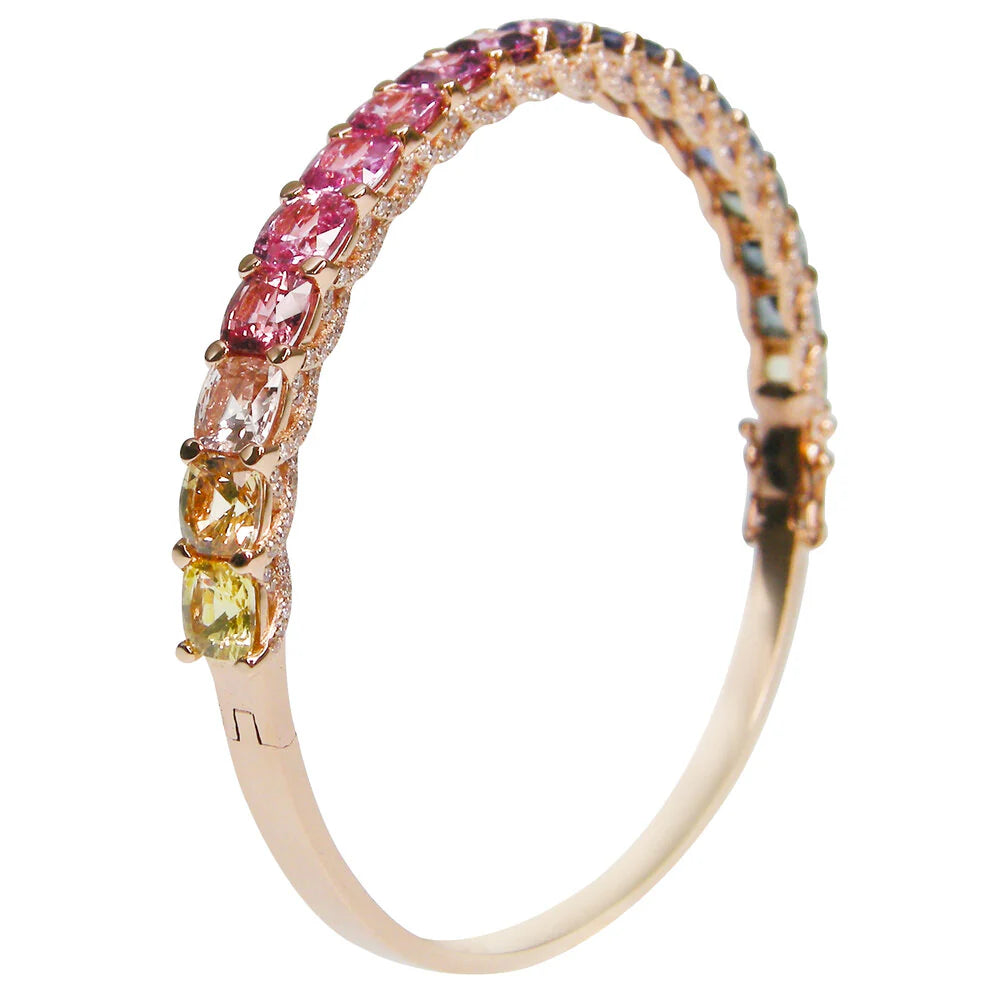 Ring with multicolored gemstones on a white background