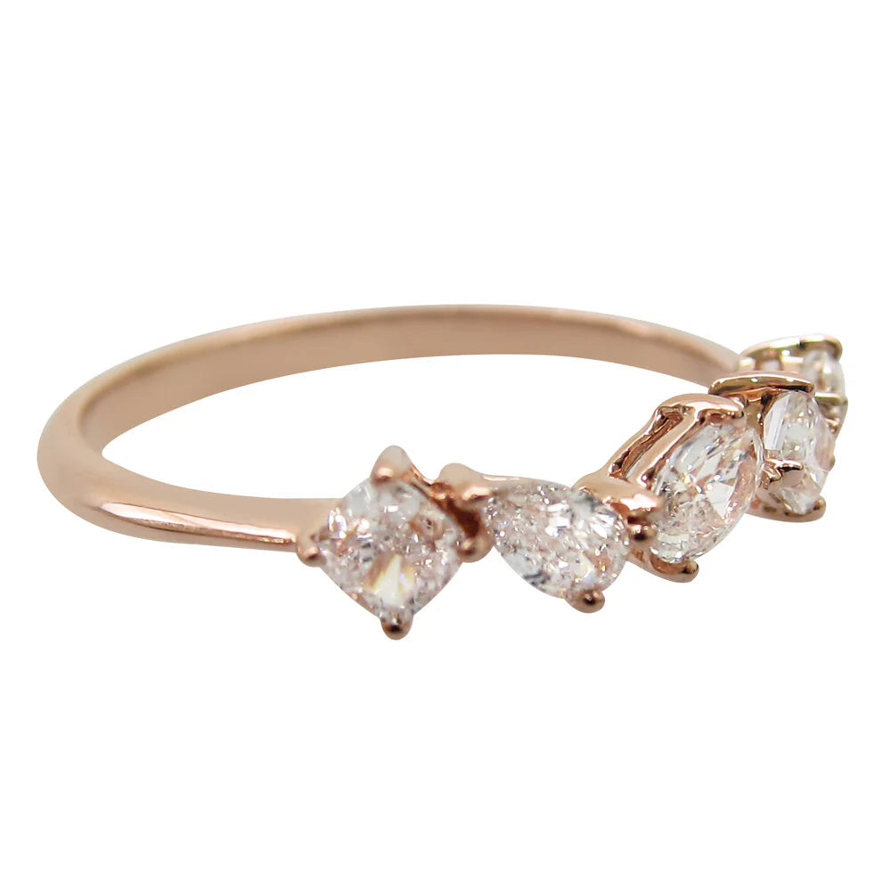 Rose gold ring with four diamonds on a white background