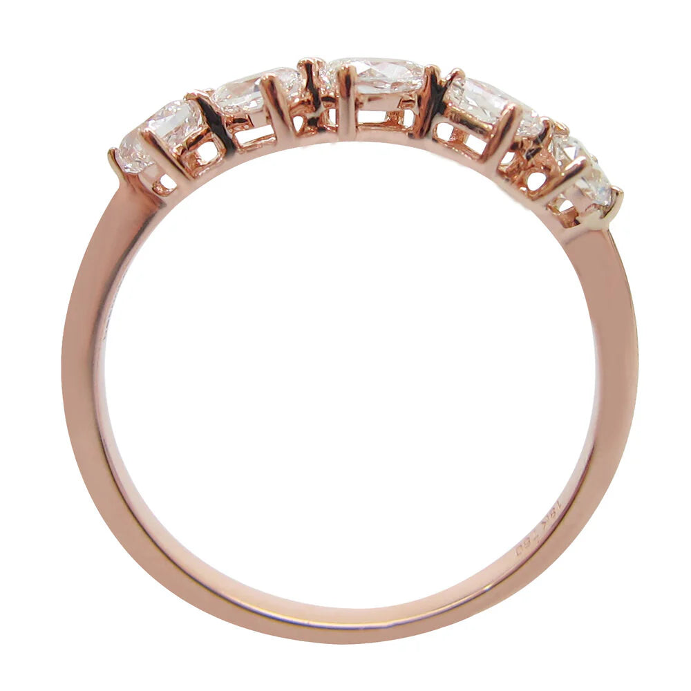 Rose gold ring with diamonds on a white background