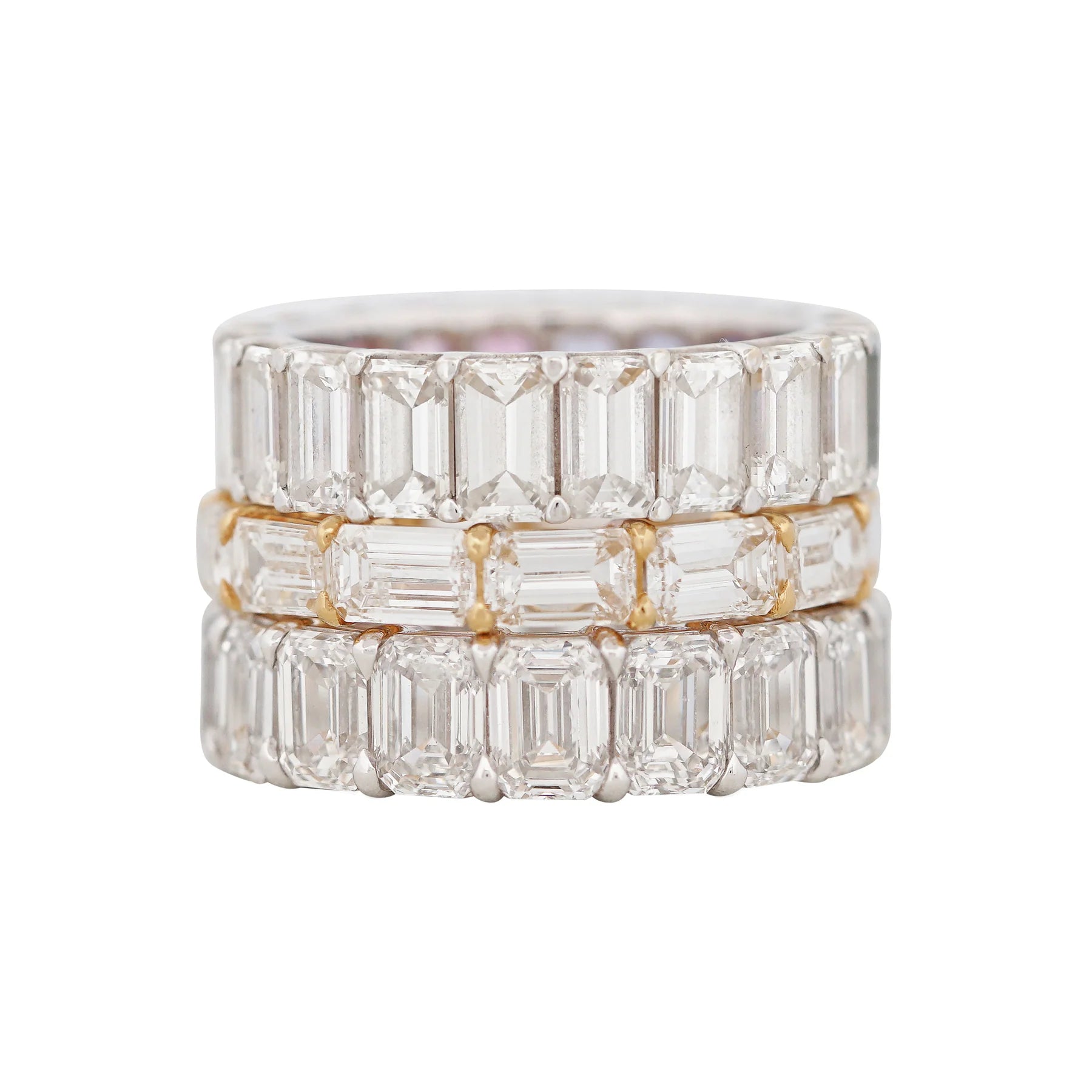 Close-up of horizontally set emerald cut diamonds in an eternity rin