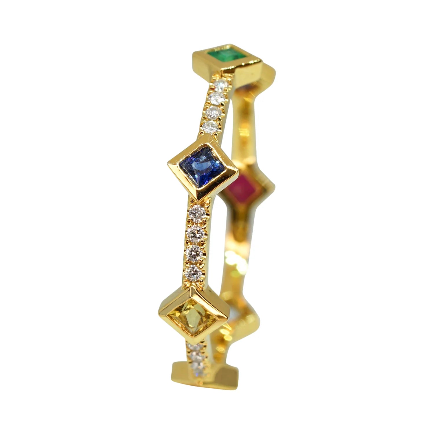 Gold ring with gemstones on a white background