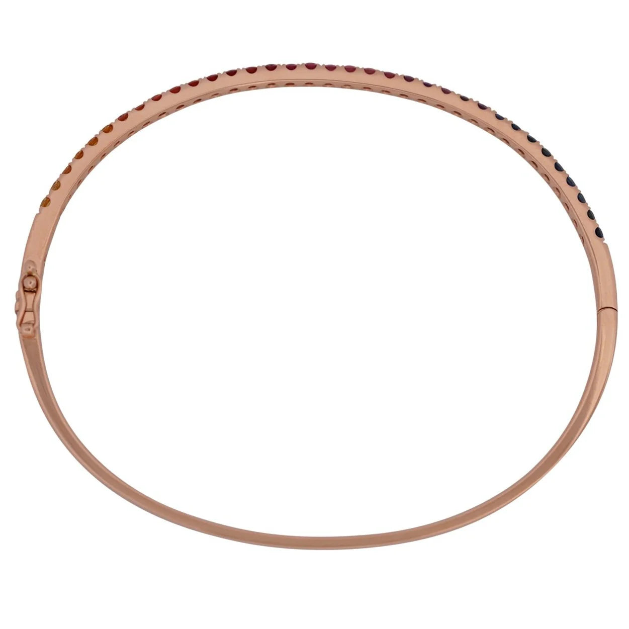 Round metallic object with a textured surface on a white background