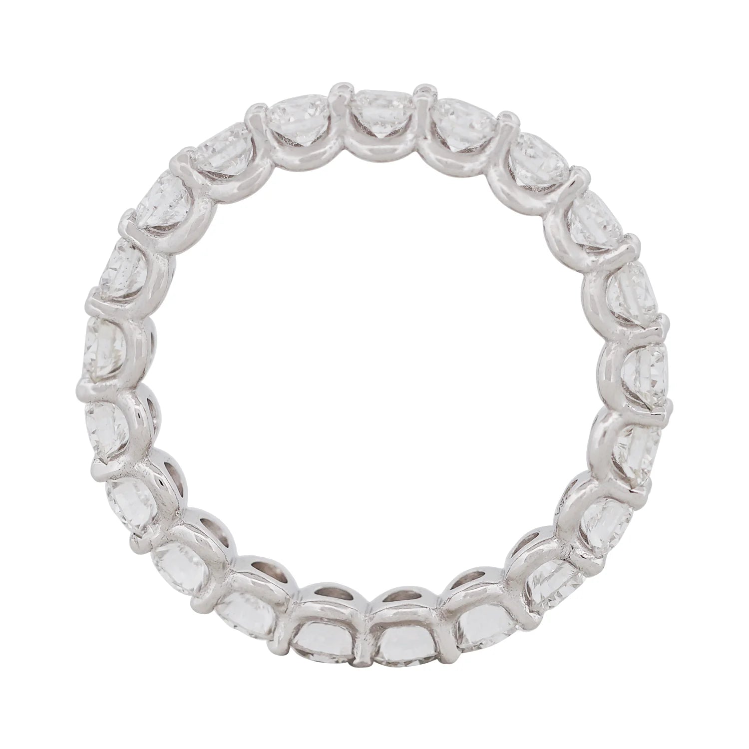Side view of a claw-set diamond eternity band showing the diamond setting