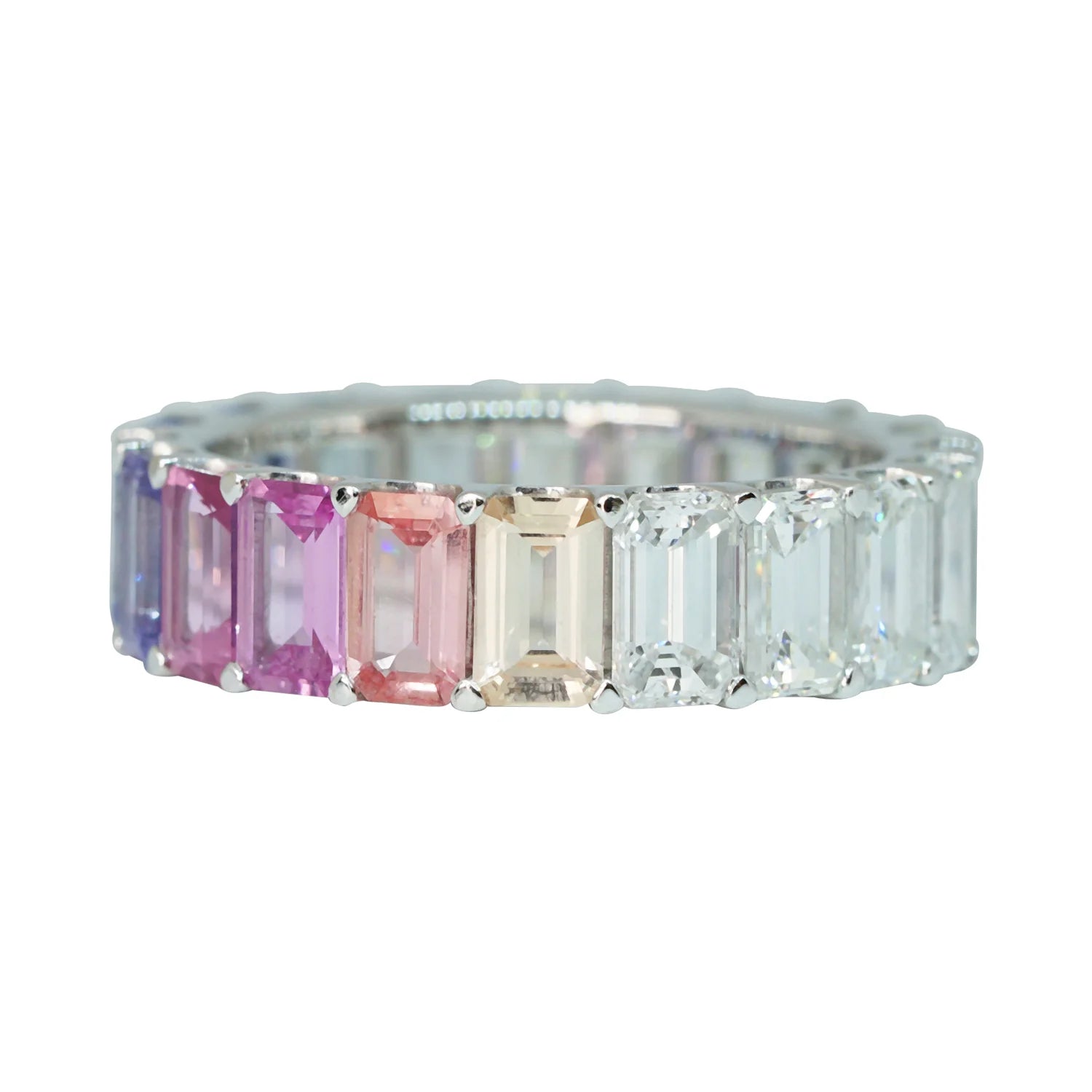 Ring with colorful gemstones on a white background