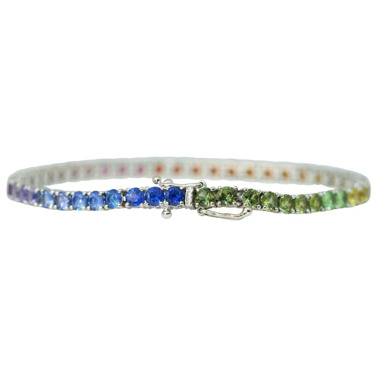Bracelet with blue and green gemstones on a white background