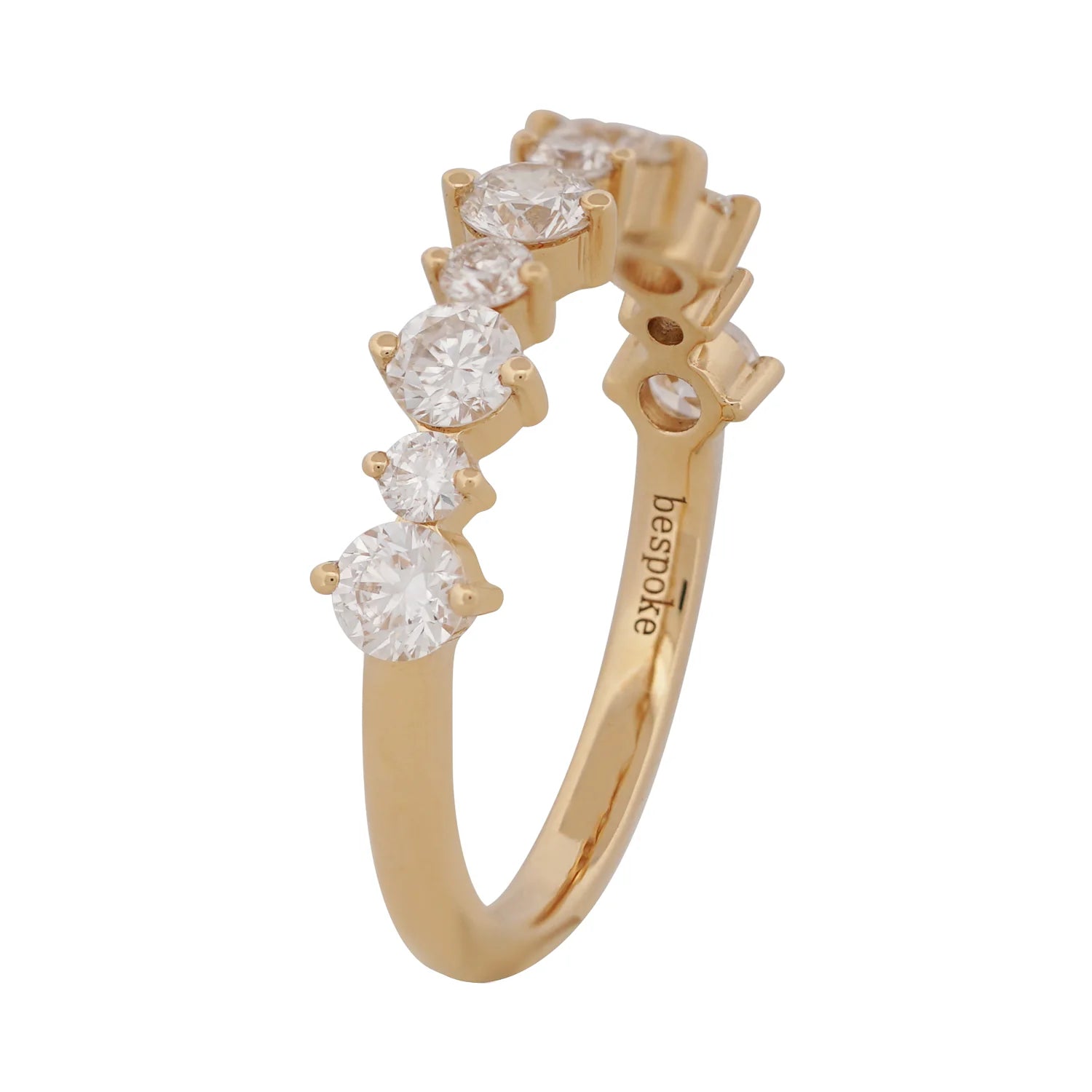 Gold ring with diamonds on a white background