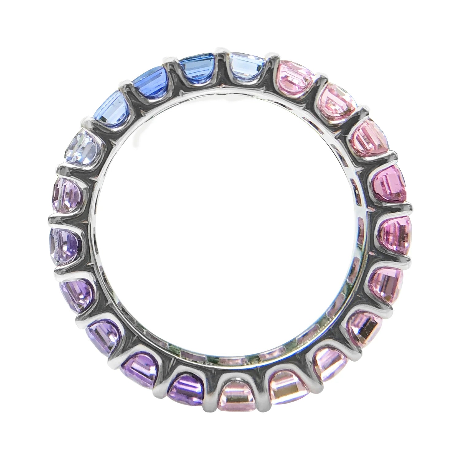 Ring with multicolored gemstones on a white background