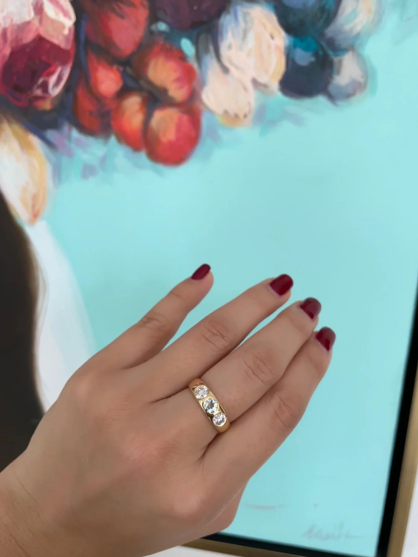 Side view of a Gemstone Trilogy Ring in 18K white gold showing the tapered band