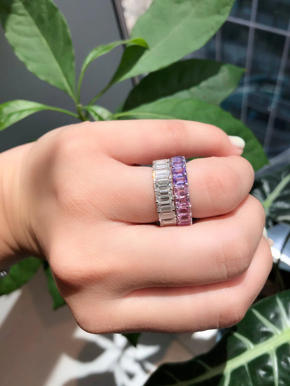 Emerald Cut Diamond Eternity Ring shown on a hand
