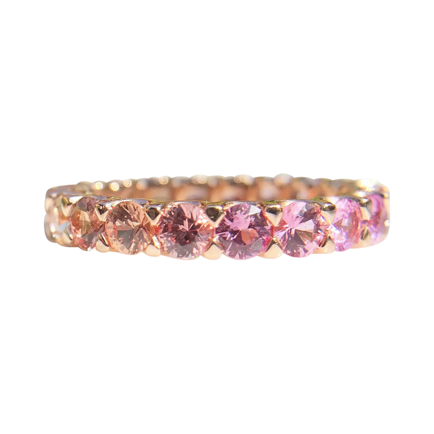 Ring with pink gemstones on a white background