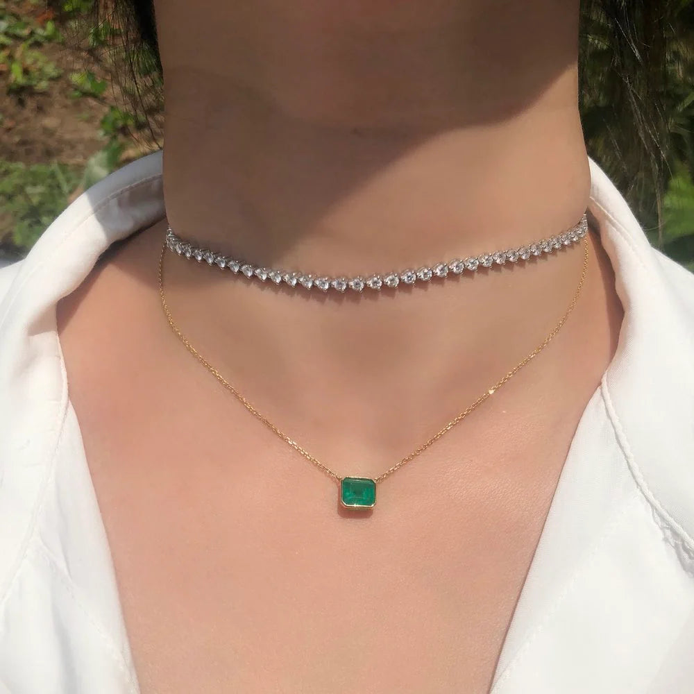 Bezel-set Emerald Solitaire Pendant